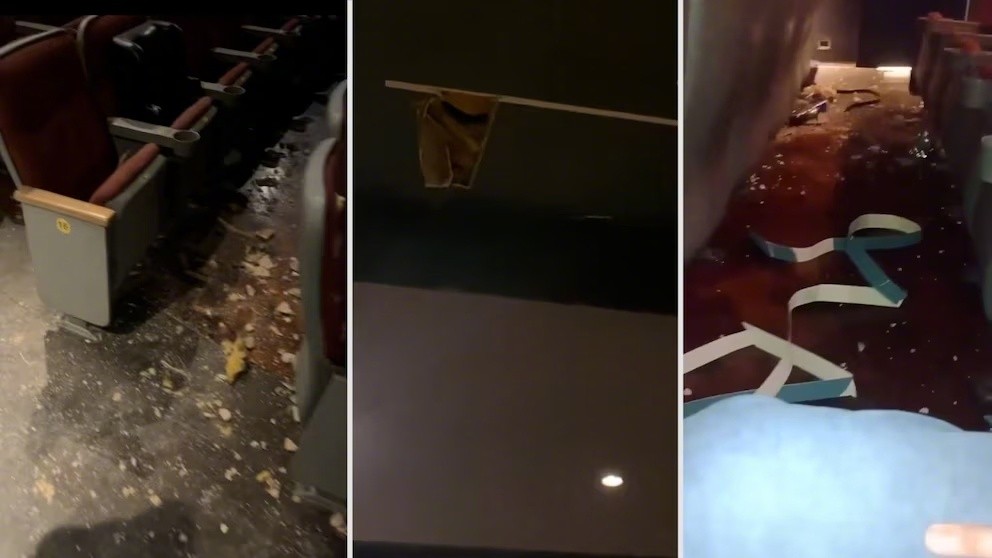 影院座位旁的地面上散落著碎片，顯示出天花板掉落後的情況。