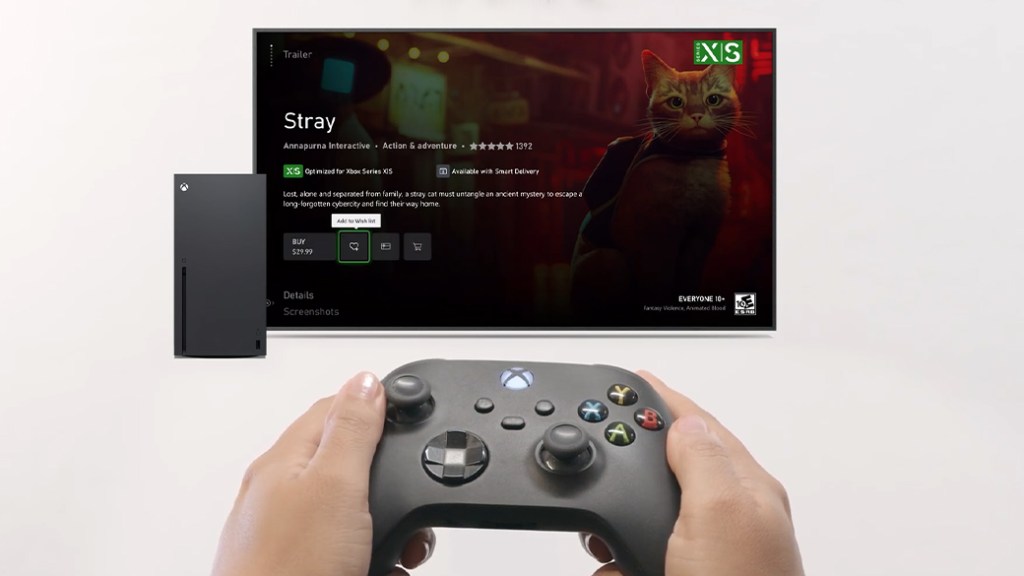 一隻手握著Xbox手柄,顯示屏上展示著遊戲《Stray》的購買選項,以及遊戲的相關信息。