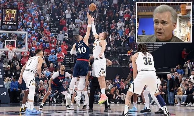 A basketball game featuring players jumping for the ball at the start of the game, with a crowd in the background. An inset image of a sports commentator appears in the corner.