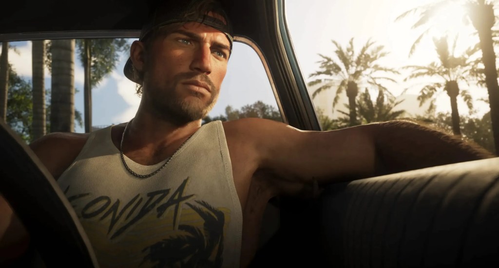 一名男性角色坐在車內，穿著有圖案的白色背心，眉頭微皺，臉部表情凝重，背景是陽光灿烂的棕櫚樹。